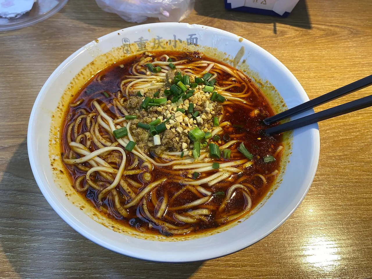 A bowl of Chongqing xiaomian in red chilli oil broth