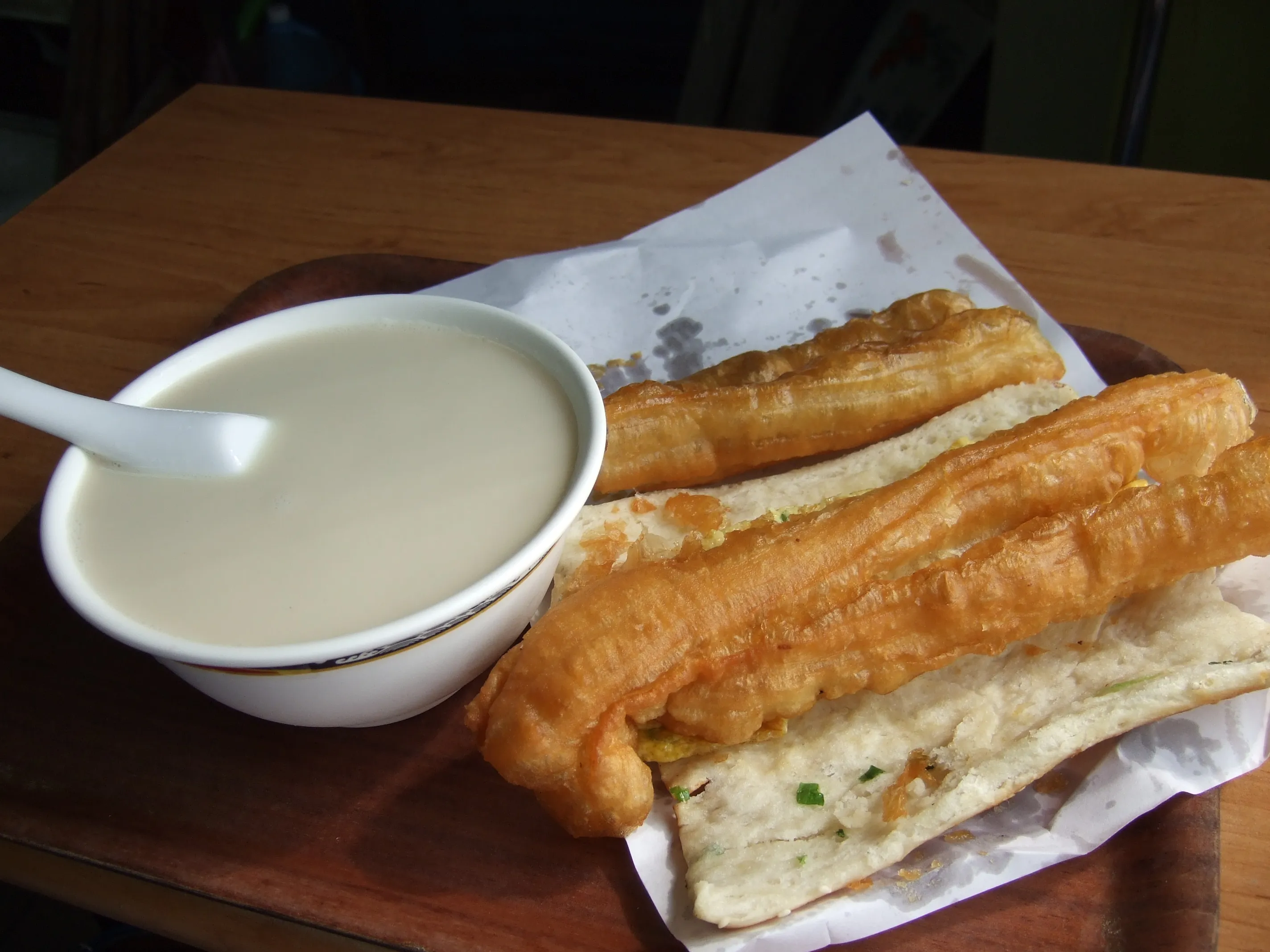 Youtiao (fried dough sticks) with a glass of fresh soy milk