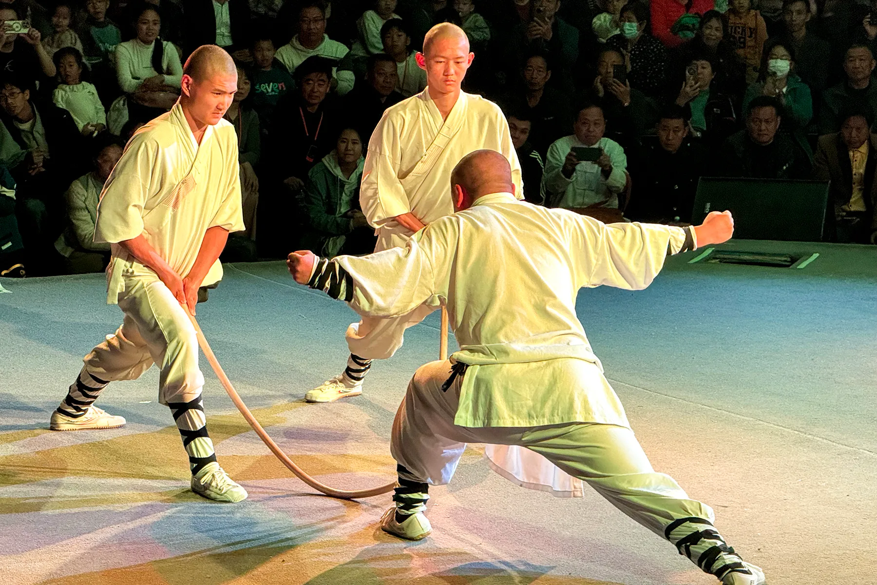 Shaolin monks demonstrating martial-arts moves on stage