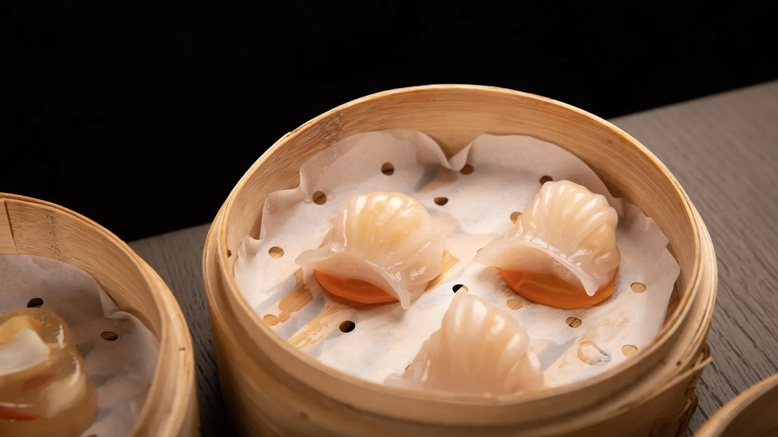 Har gow shrimp dumplings in a bamboo steamer