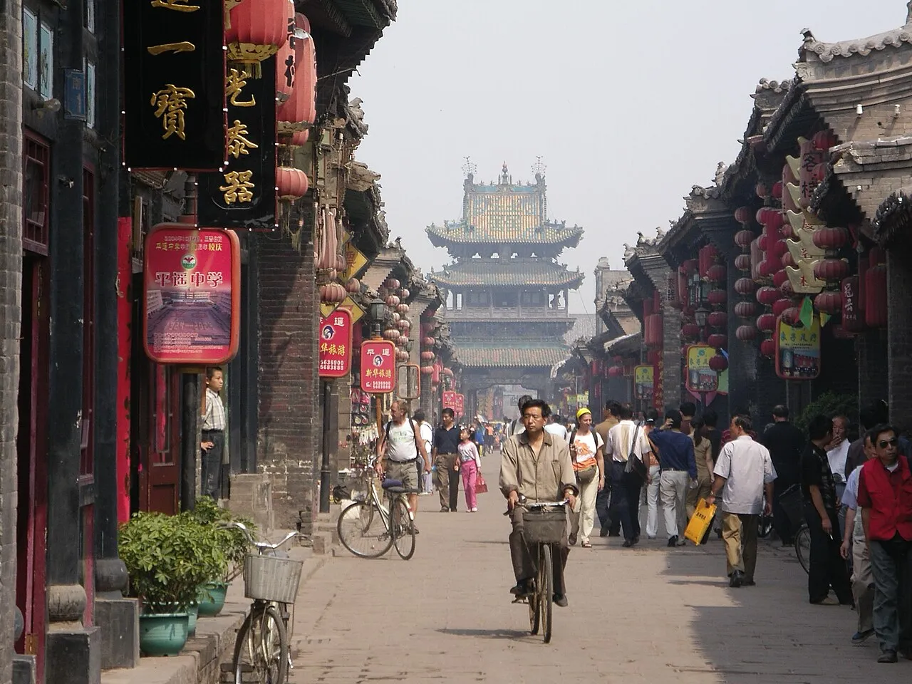 A preserved ancient Chinese town of grey-tiled courtyard houses and lanes