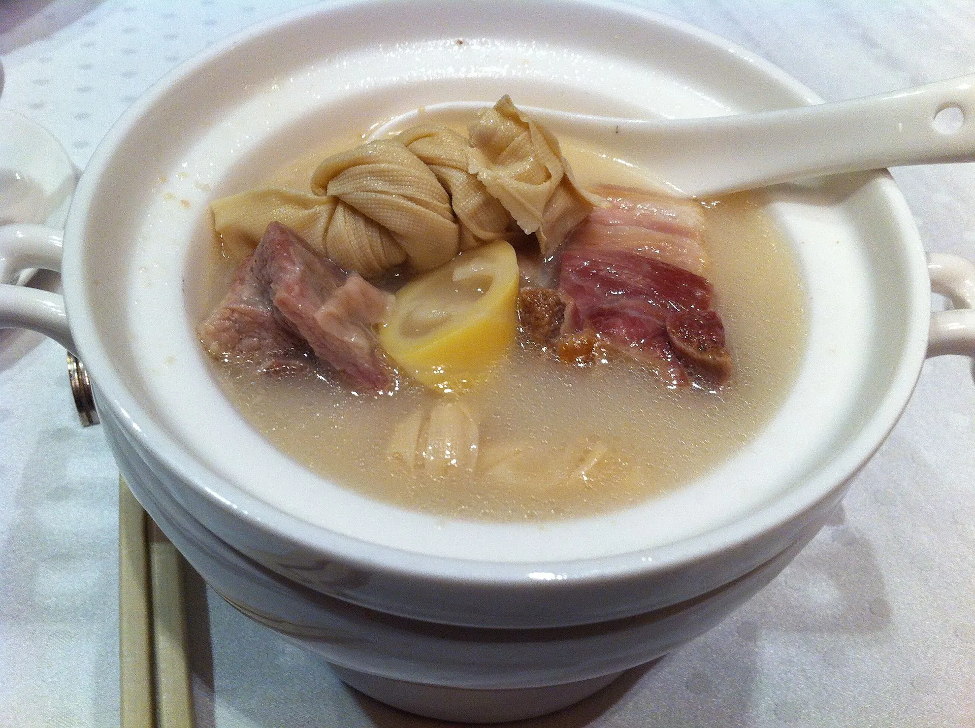 A pot of yanduxian soup with fresh and cured pork, bamboo shoots and tofu knots