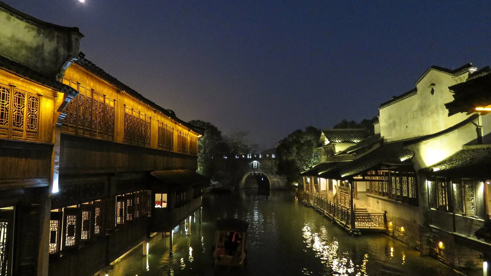 Wuzhen Xizha canal glowing under the moon at night